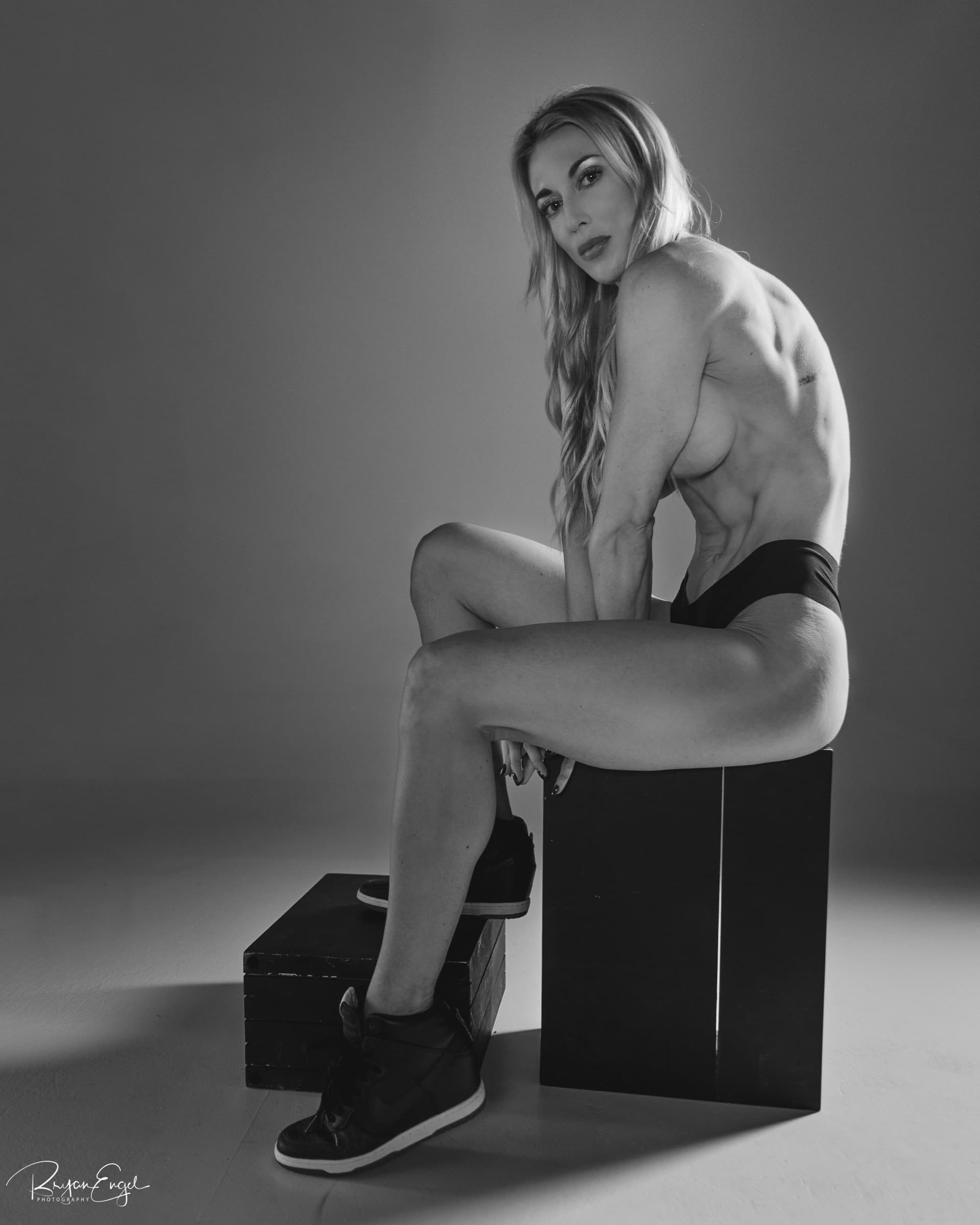 Figure competitor showing muscle symmetry and conditioning — Bryan Engel Photography, San Diego CA
